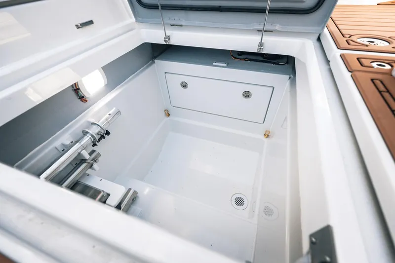 Slide: The Image of Open storage compartment on 2025 Lindell 48' boat, featuring sleek design and modern fittings. - 33