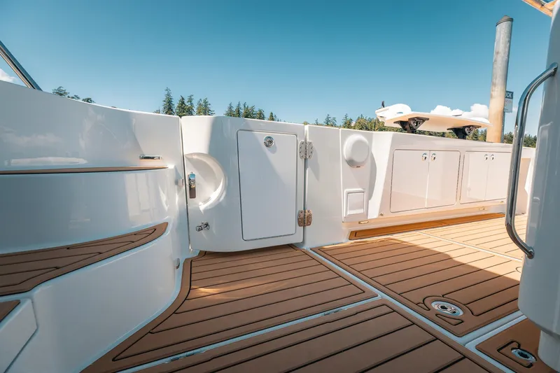 Slide: The Image of Luxurious Lindell 48' yacht deck, 2025 model, featuring sleek design and wood flooring. - 35