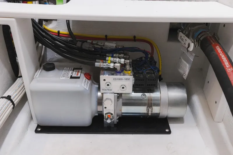 Slide: The Image of Engine compartment of 2025 Lindell 48' boat, featuring hydraulic system and wiring. - 39