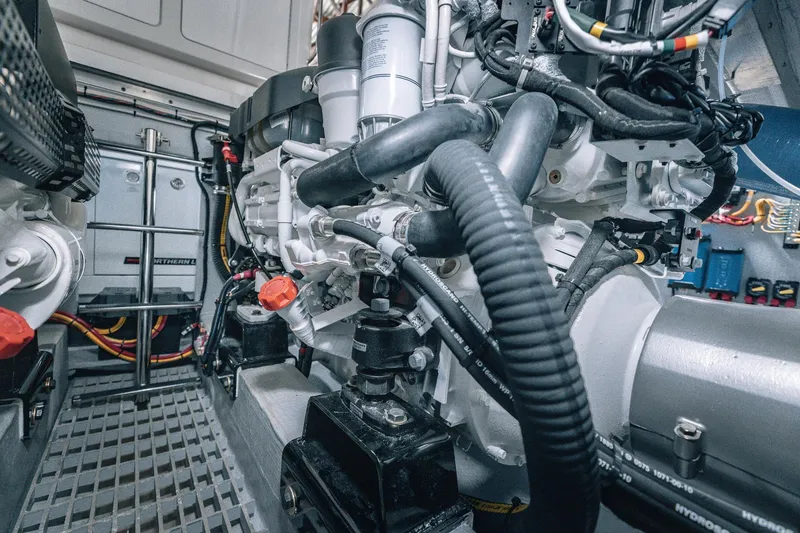 Slide: The Image of Engine room of 2025 Lindell 48' boat, showcasing complex machinery and wiring. - 40