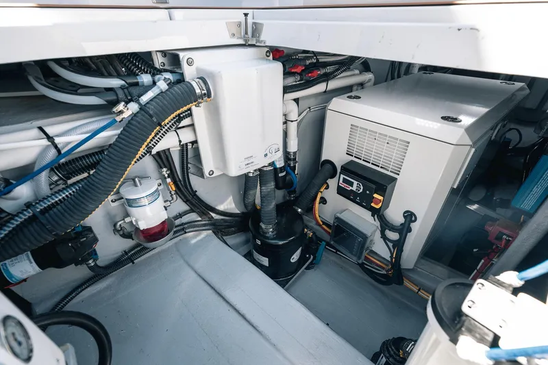 Slide: The Image of Engine room of 2025 Lindell 48' yacht with modern equipment and wiring. - 43