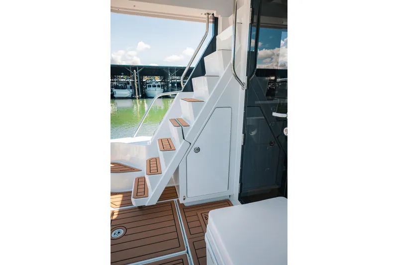 Slide: The Image of Staircase on 2025 Lindell 48' yacht with teak steps and modern design. - 46