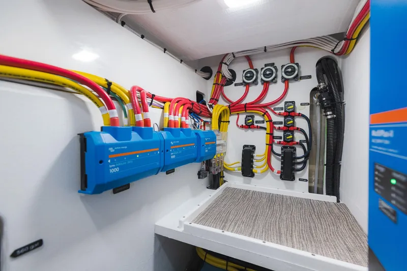 Slide: The Image of Electrical system of a 2025 Lindell 48' boat with organized wiring and components. - 48