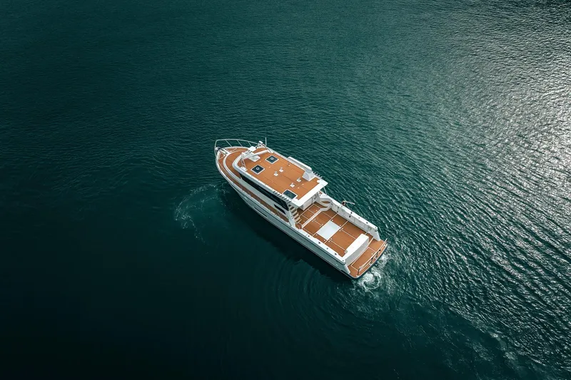 Slide: The Image of Aerial view of 2025 Lindell 48' yacht cruising on open water. - 51