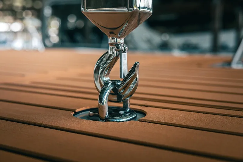 Slide: The Image of Close-up of a Lindell 48' 2025 boat deck with polished metal fitting. - 60
