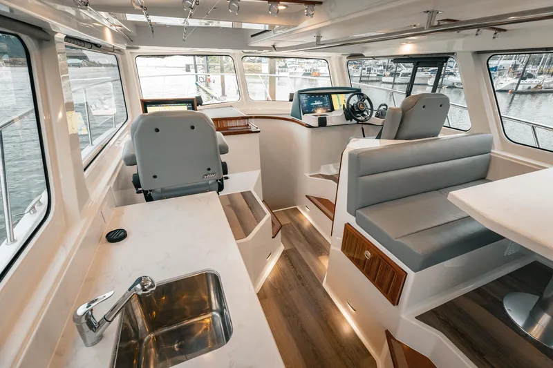 Slide: The Image of Modern Lindell 48' yacht interior, 2025 model, featuring sleek design and advanced navigation systems. - 8
