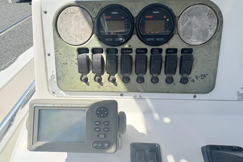 Slide: The Image of Century 2300 Center Console 2002 dashboard with Yamaha gauges and Furuno GPS navigator. - 13