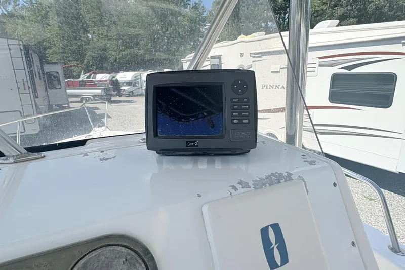 Slide: The Image of Century 2300 Center Console 2002 with marine navigation system on dashboard. - 14