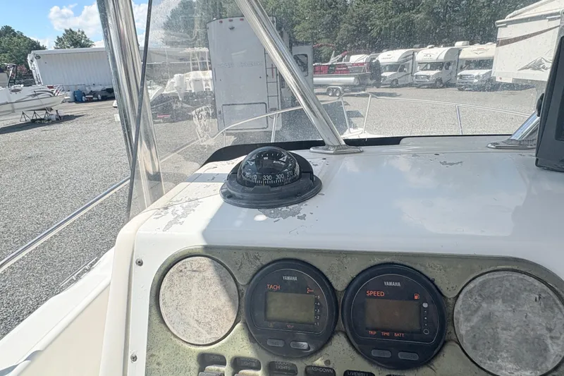 Slide: The Image of Century 2300 Center Console 2002 dashboard with compass and Yamaha gauges. - 15