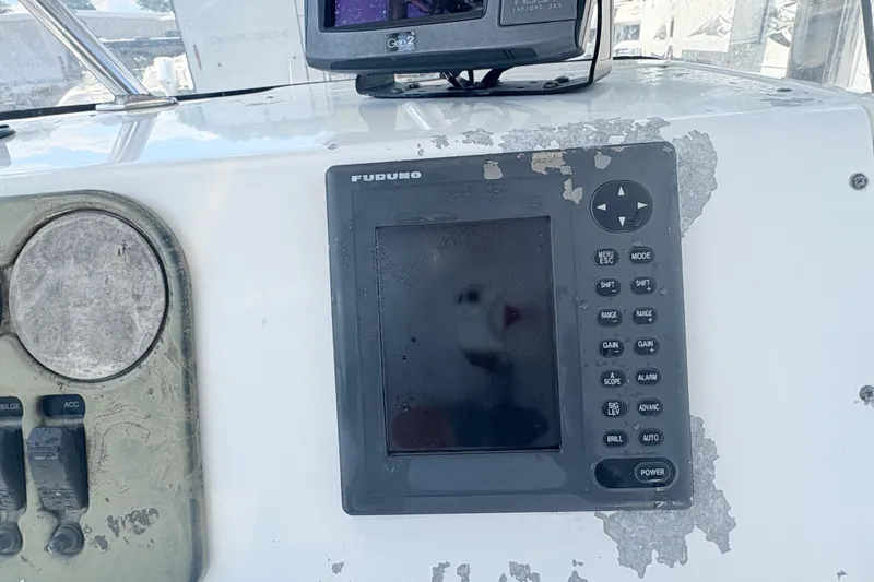 Slide: The Image of Century 2300 Center Console 2002 boat dashboard with Furuno navigation system. - 16