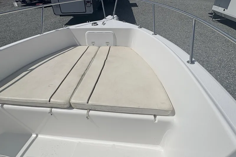 Slide: The Image of 2002 Century 2300 Center Console boat with cushioned bow seating. - 17