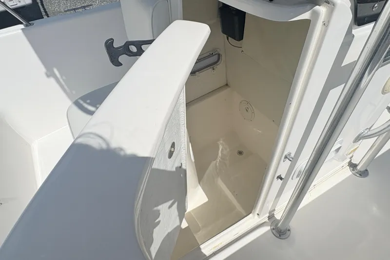 Slide: The Image of Open storage compartment on a 2002 Century 2300 Center Console boat. - 20