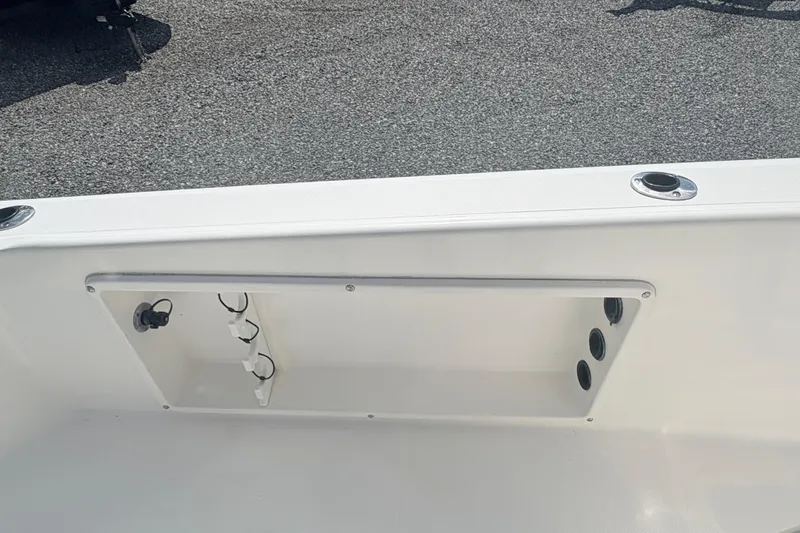Slide: The Image of 2002 Century 2300 Center Console boat interior detail with rod holders. - 24