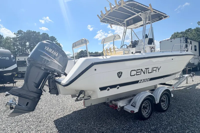Slide: The Image of 2002 Century 2300 Center Console boat with Yamaha engine on trailer. - 4