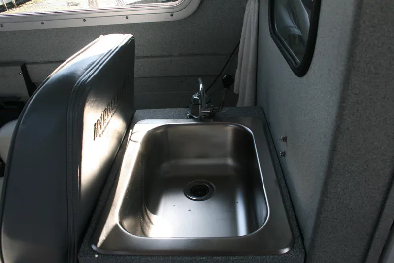 Slide: The Image of Stainless steel sink in 2007 Harbercraft 2425 Pilot House boat interior. - 10
