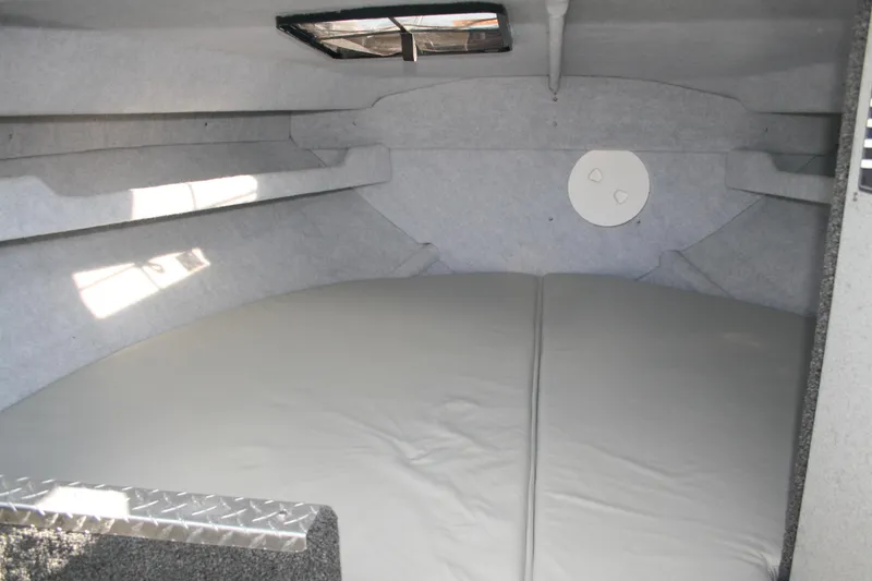 Slide: The Image of 2007 Harbercraft 2425 Pilot House interior cabin with cushioned seating. - 11