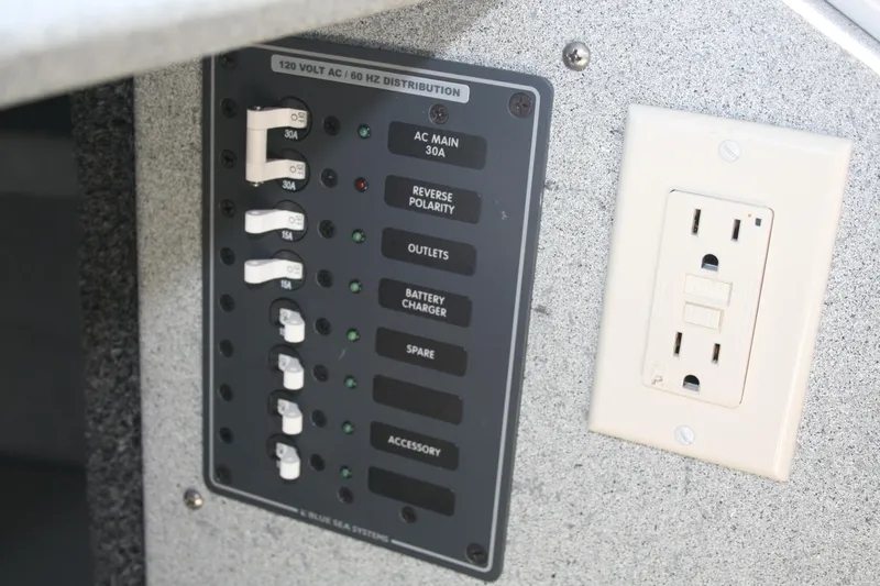 Slide: The Image of Electrical panel and outlet on 2007 Harbercraft 2425 Pilot House boat. - 13