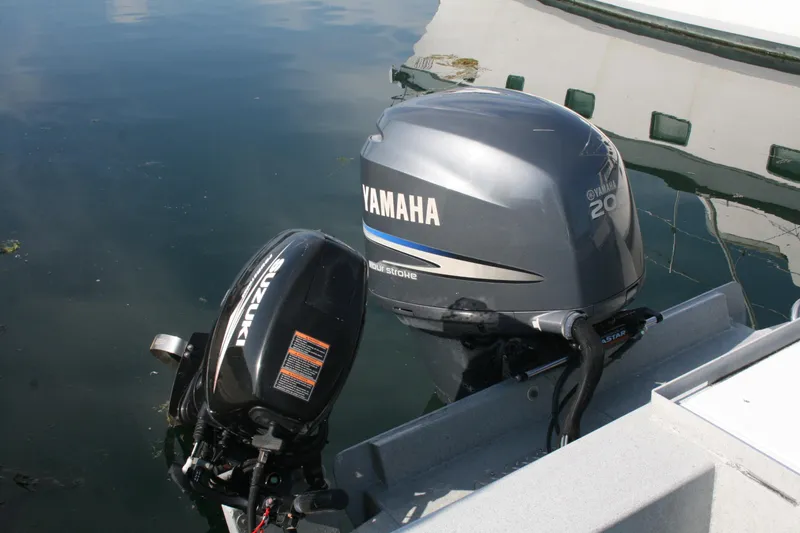 Slide: The Image of 2007 Harbercraft 2425 Pilot House with Yamaha and Suzuki outboard motors. - 20