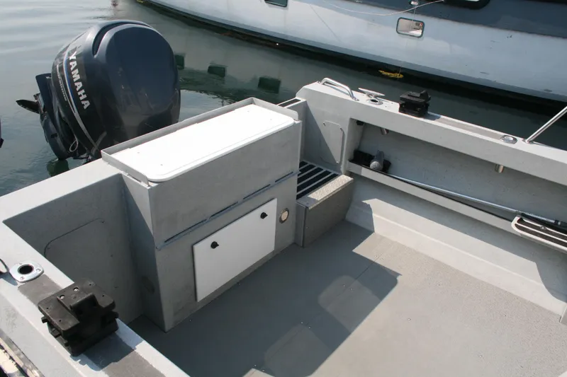 Slide: The Image of 2007 Harbercraft 2425 Pilot House boat interior with Yamaha outboard motor. - 22