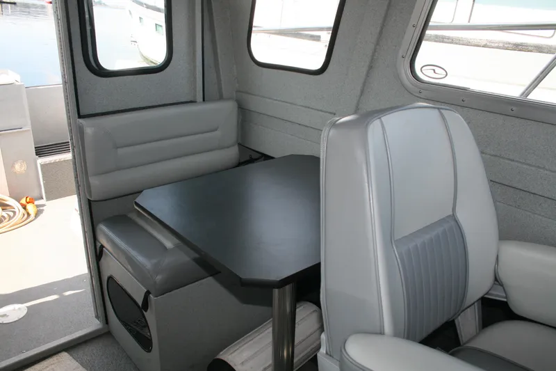 Slide: The Image of Interior of 2007 Harbercraft 2425 Pilot House with seating and table. - 7