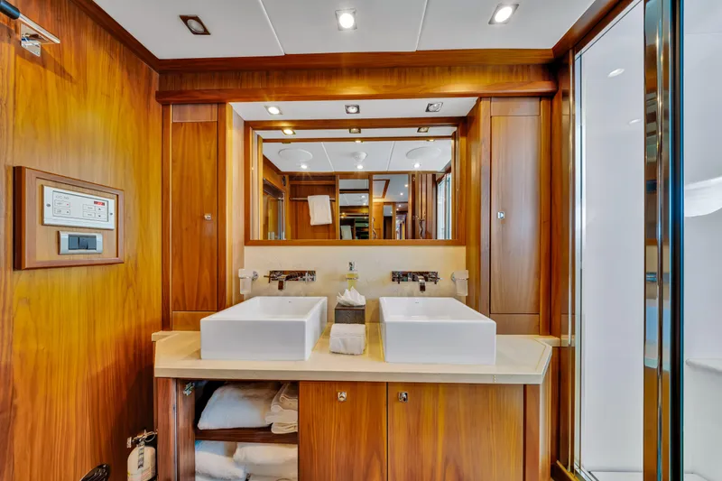 Slide: The Image of Luxurious bathroom on 2009 Sunseeker 37 Metre Yacht with dual sinks and wooden cabinetry. - 18
