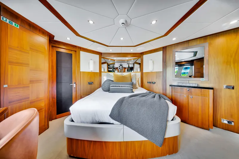 Slide: The Image of Luxurious bedroom interior on 2009 Sunseeker 37 Metre Yacht with modern wood paneling. - 21