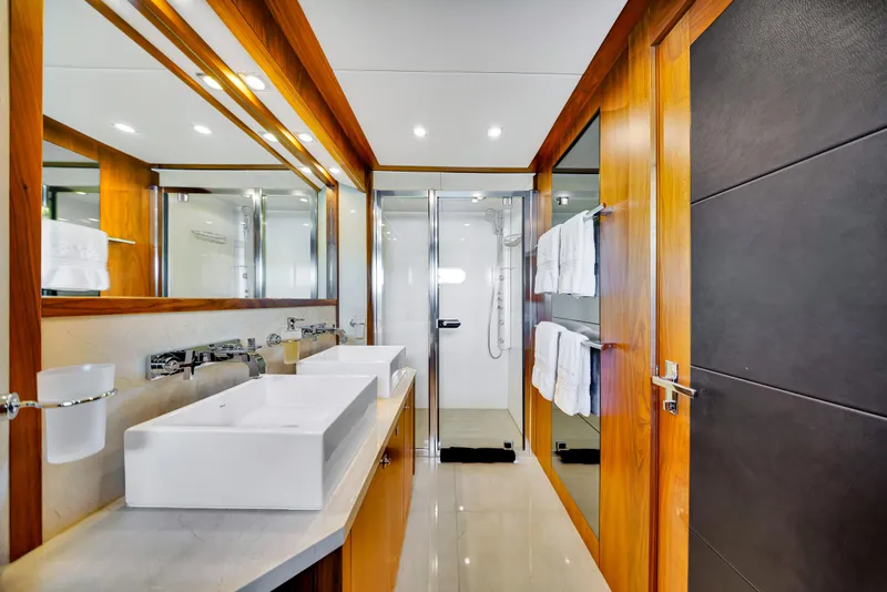 Slide: The Image of Luxurious bathroom on 2009 Sunseeker 37 Metre Yacht with dual sinks and modern shower. - 23