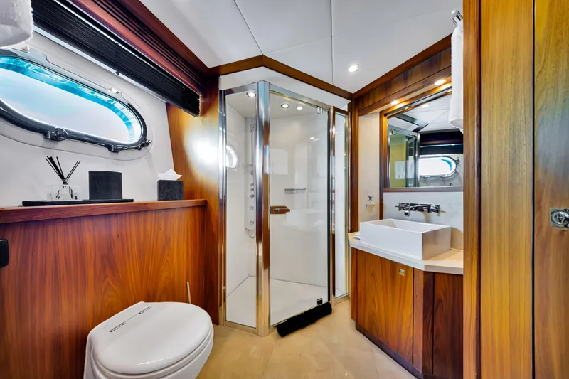 Slide: The Image of Luxurious bathroom on a 2009 Sunseeker 37 Metre Yacht, featuring wood accents and modern fixtures. - 27