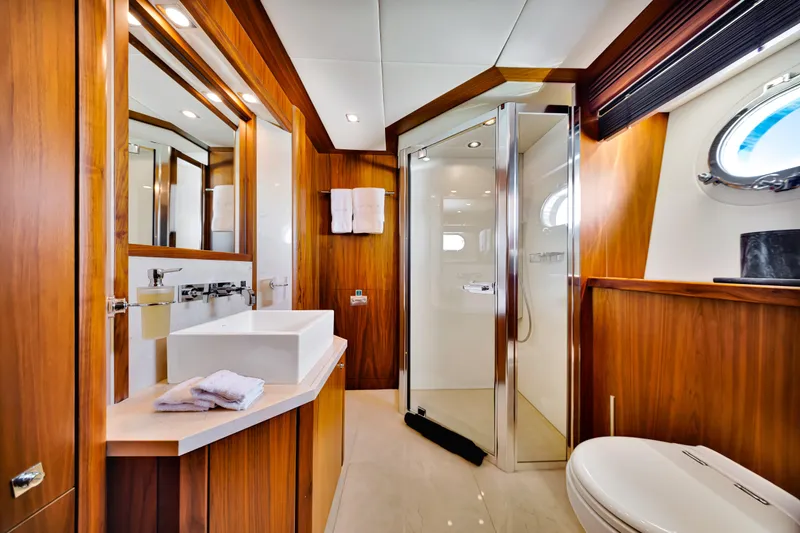 Slide: The Image of Luxurious bathroom on 2009 Sunseeker 37 Metre Yacht with wood accents and modern fixtures. - 29