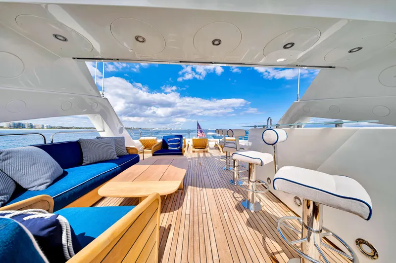 Slide: The Image of Luxurious Sunseeker 37 Metre Yacht deck with elegant seating, ocean view, and clear blue sky. - 39