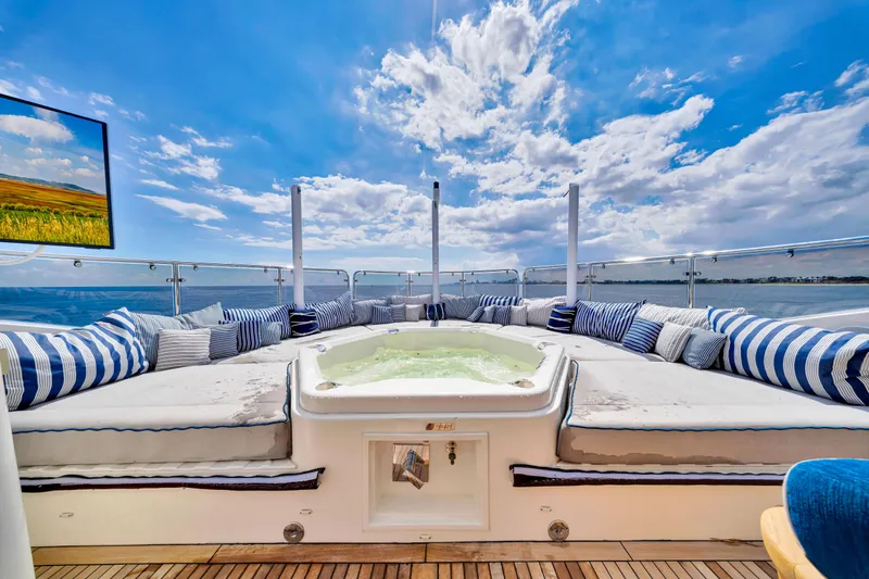 Slide: The Image of Luxurious Sunseeker 37 Metre Yacht 2009 with jacuzzi, striped cushions, and ocean view. - 40