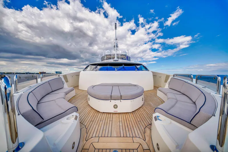Slide: The Image of Luxurious 2009 Sunseeker 37 Metre Yacht deck with plush seating under a vibrant sky. - 43