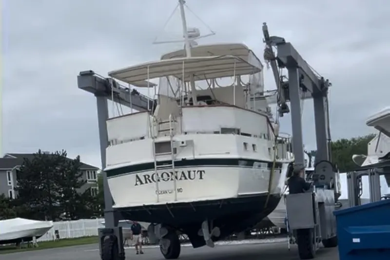 Slide: The Image of 1980 Hatteras 42 LRC yacht "Argonaut" on a lift at a marina. - 36