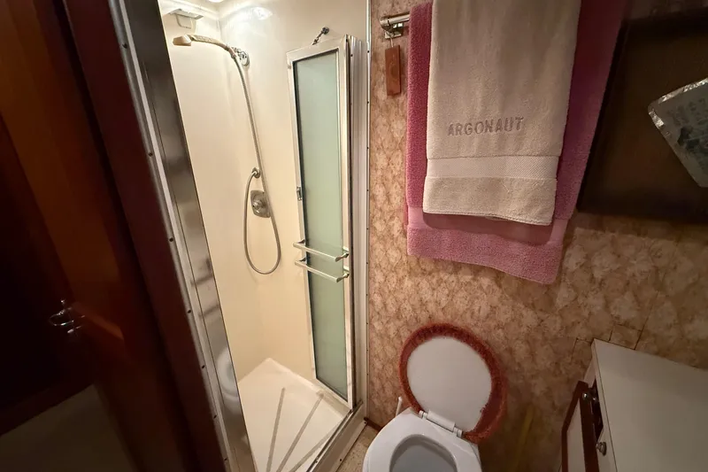 Slide: The Image of 1980 Hatteras 42 LRC kitchen with stove, coffee maker, and dish rack. - 9