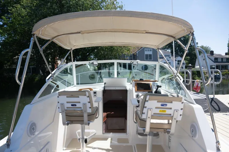 Slide: The Image of 2004 Hunt Yachts Surfhunter 25 cockpit with canopy and dual seating. - 23