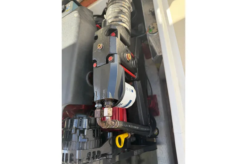 Slide: The Image of Engine components of a 2004 Hunt Yachts Surfhunter 25, showcasing detailed mechanical parts. - 43