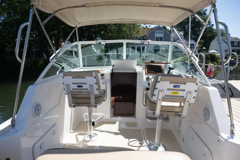 Slide: The Image of 2004 Hunt Yachts Surfhunter 25 cockpit with dual seats and canopy. - 12