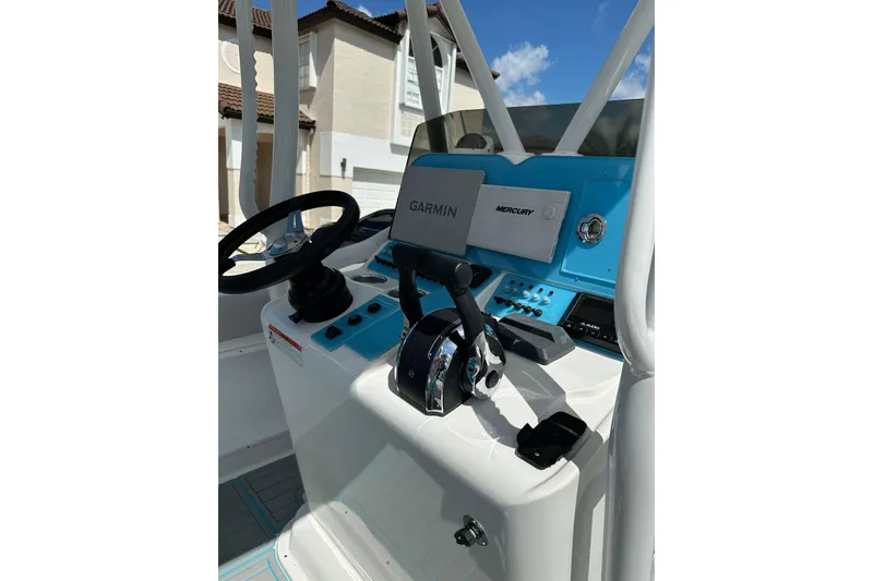 Slide: The Image of 2019 Concept 27' CC boat helm with Garmin and Mercury controls. - 16