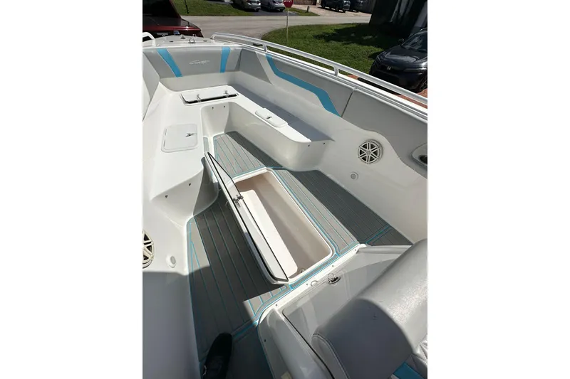 Slide: The Image of 2019 Concept 27' CC boat interior with open storage compartment and sleek seating. - 23