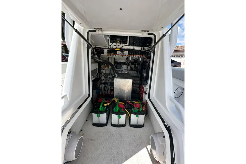 Slide: The Image of Interior view of 2019 Concept 27' CC boat showing battery compartment and wiring. - 24