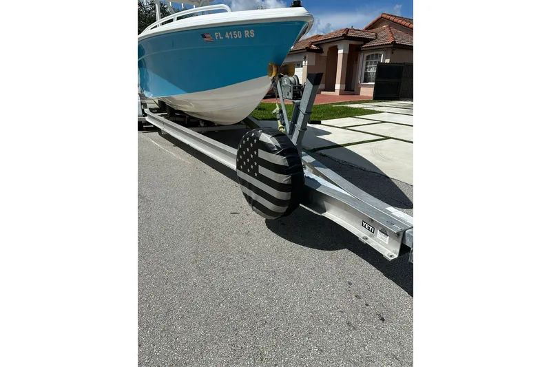 Slide: The Image of 2019 Concept 27' CC boat on trailer with American flag tire cover. - 4
