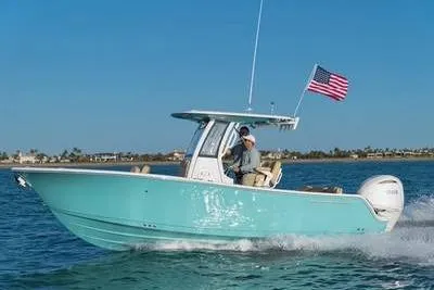 Slide: The Image of 2026 Sportsman Heritage 231 Center Console boat with Yamaha engine on trailer. - 1