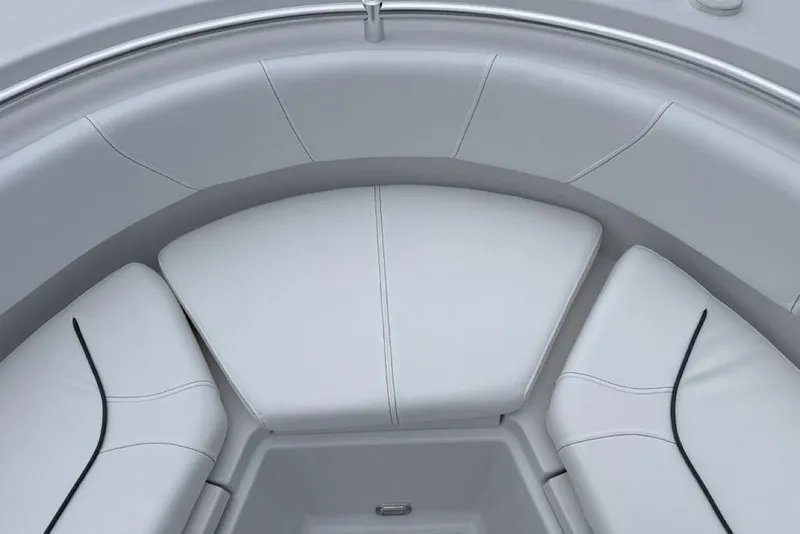 Slide: The Image of 2026 Sportsman Heritage 231 Center Console boat interior with cushioned seating. - 14