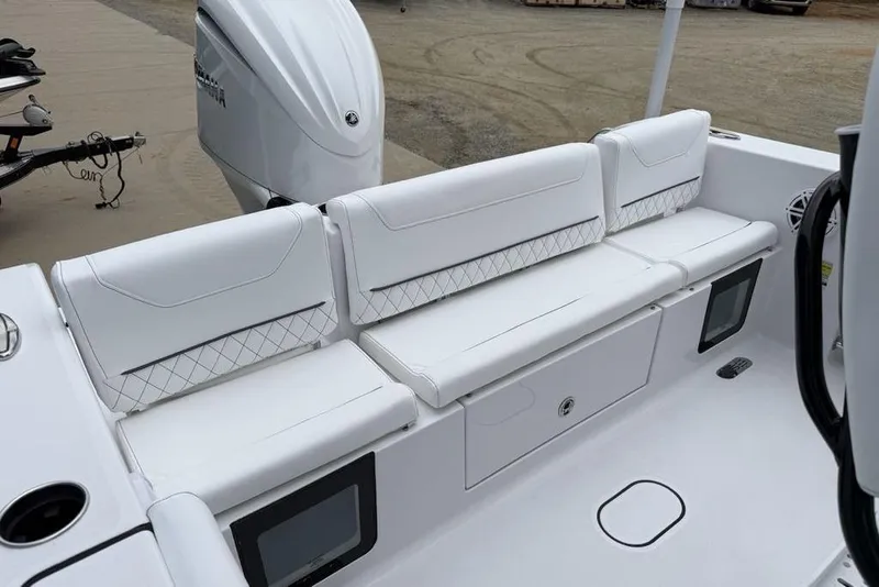 Slide: The Image of 2026 Sportsman Heritage 231 Center Console boat with white seating and modern design. - 26