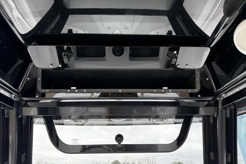 Slide: The Image of 2026 Sportsman Heritage 231 Center Console interior view, showcasing sleek design and storage features. - 27