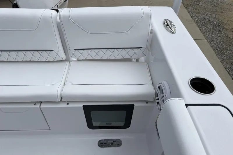 Slide: The Image of 2026 Sportsman Heritage 231 Center Console boat interior with white cushioned seating. - 35
