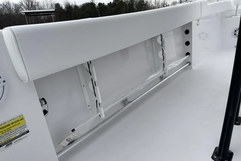 Slide: The Image of 2026 Sportsman Heritage 231 Center Console interior with sleek white seating and storage. - 37