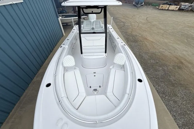 Slide: The Image of 2026 Sportsman Heritage 231 Center Console boat with sleek white interior design. - 39