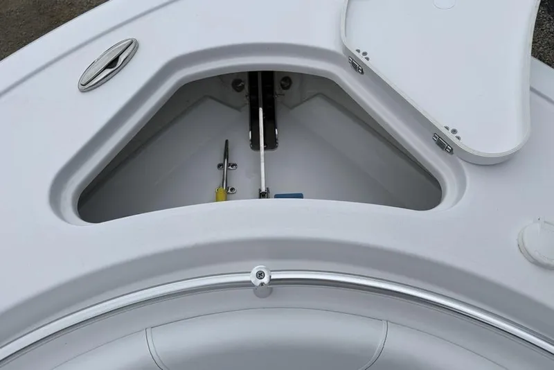 Slide: The Image of 2026 Sportsman Heritage 231 Center Console anchor storage compartment, open lid view. - 5