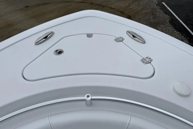 Slide: The Image of 2026 Sportsman Heritage 231 Center Console boat deck with storage compartment. - 6